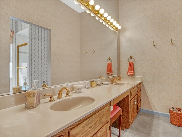 bathroom featuring dual sinks and vanity with extensive cabinet space