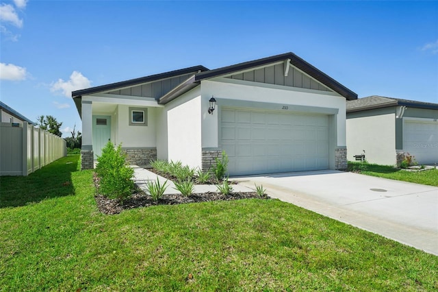 view of front facade featuring a front yard and a garage