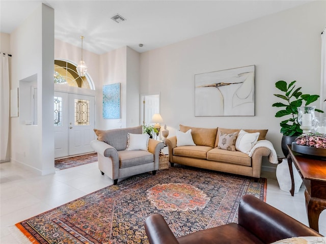 living room with tile flooring and a high ceiling