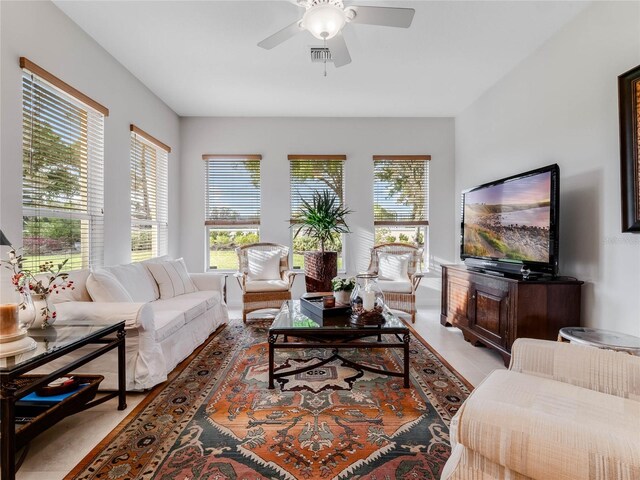 living room featuring ceiling fan and light tile floors