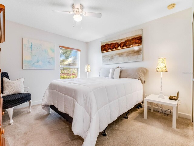 bedroom with ceiling fan and carpet floors