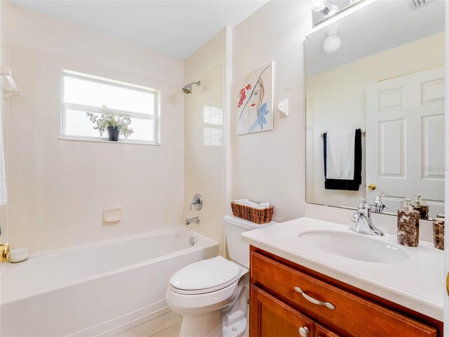 full bathroom featuring tile floors,  shower combination, vanity, and toilet