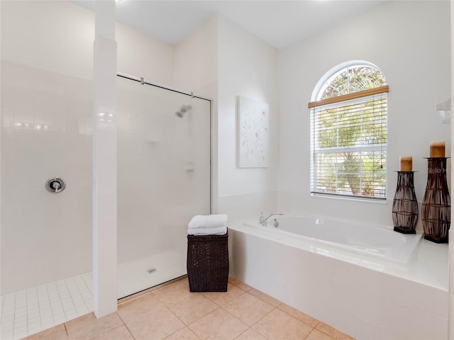 bathroom featuring tile flooring and independent shower and bath