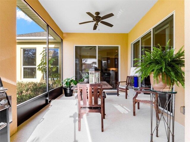 sunroom / solarium with ceiling fan