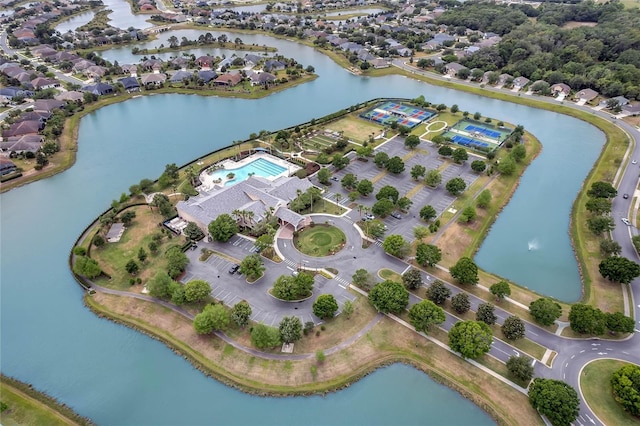 birds eye view of property with a water view