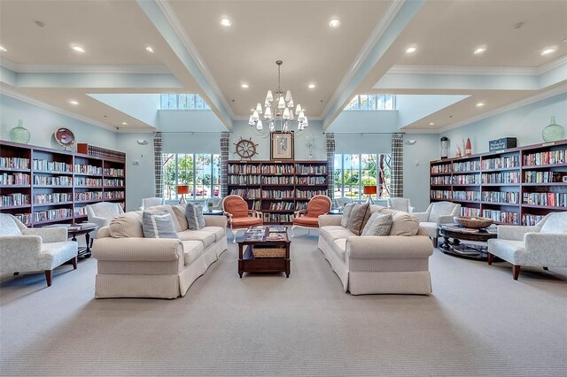 carpeted living room with a notable chandelier, a towering ceiling, and ornamental molding