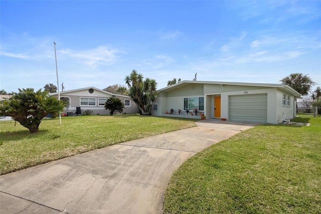 single story home featuring a garage and a front yard