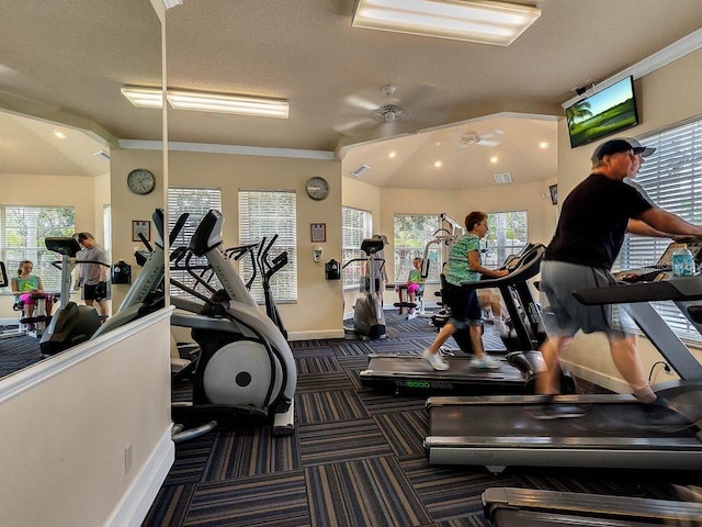 gym with crown molding, a healthy amount of sunlight, and ceiling fan