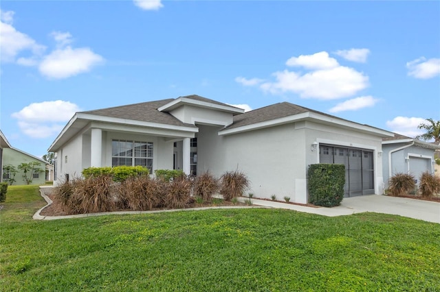 view of front of home with a front lawn and a garage