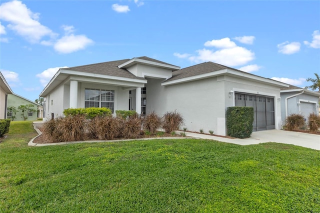 view of front of property with a garage and a front yard