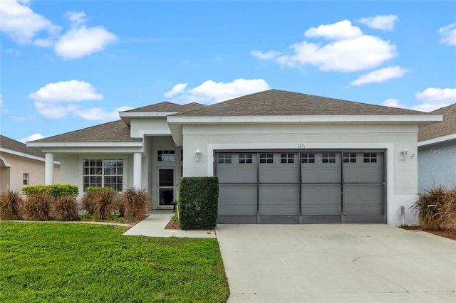 view of front facade featuring a front lawn and a garage