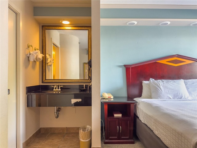 tiled bedroom featuring sink