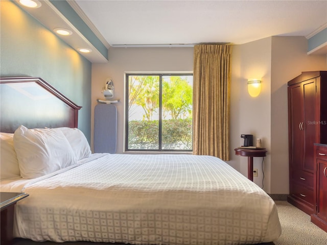 bedroom with light colored carpet