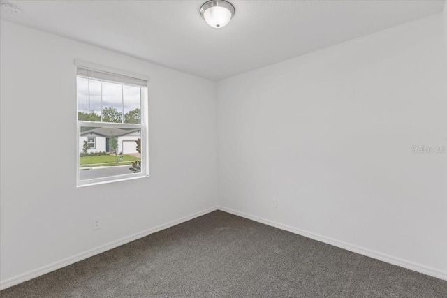 unfurnished room featuring carpet floors