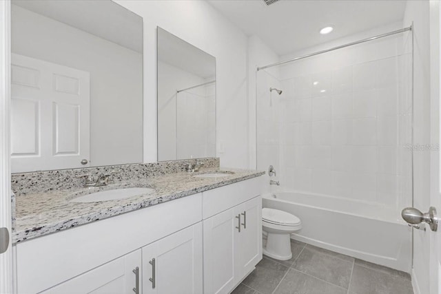 full bathroom featuring shower / tub combination, tile patterned floors, vanity, and toilet