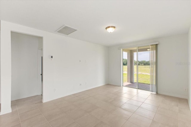 view of tiled spare room