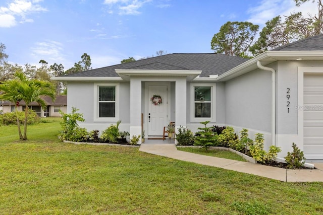 ranch-style home featuring a front yard