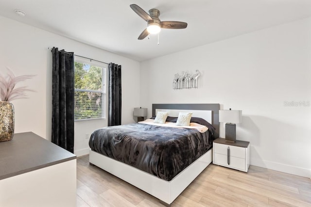 bedroom featuring ceiling fan and light hardwood / wood-style flooring