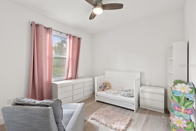 bedroom featuring light hardwood / wood-style floors and ceiling fan