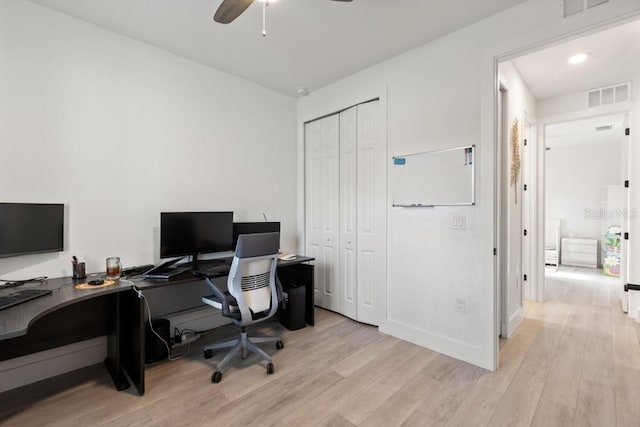 office with ceiling fan and light wood-type flooring