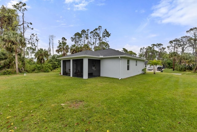 back of house featuring a yard