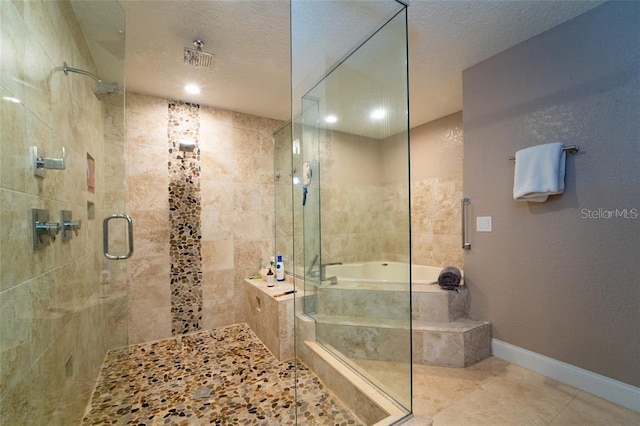 bathroom with a textured ceiling, walk in shower, and tile patterned flooring