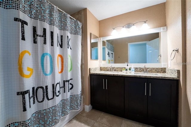 bathroom featuring dual vanity and tile patterned flooring