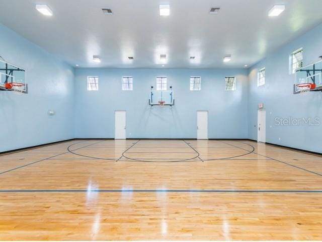 view of basketball court with a wealth of natural light and community basketball court