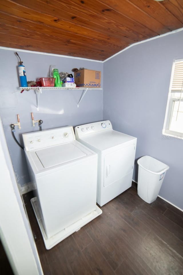 washroom featuring dark hardwood / wood-style flooring, washer and clothes dryer, and wooden ceiling