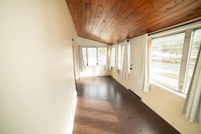 hallway featuring dark wood-type flooring, vaulted ceiling, and wooden ceiling