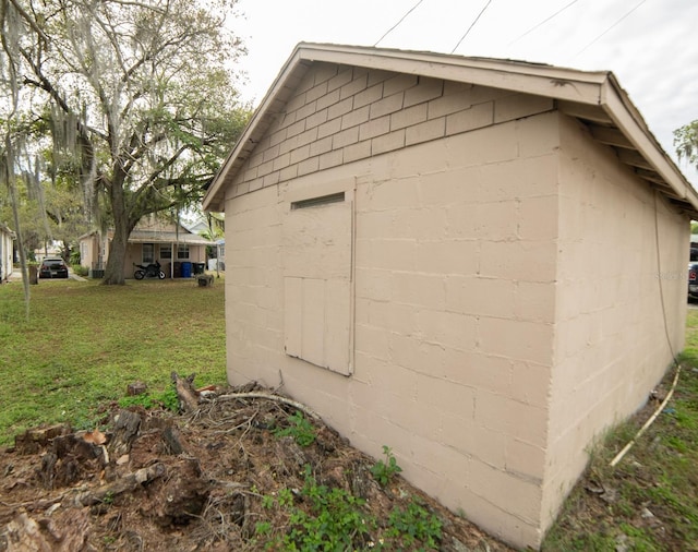 view of outdoor structure with a lawn