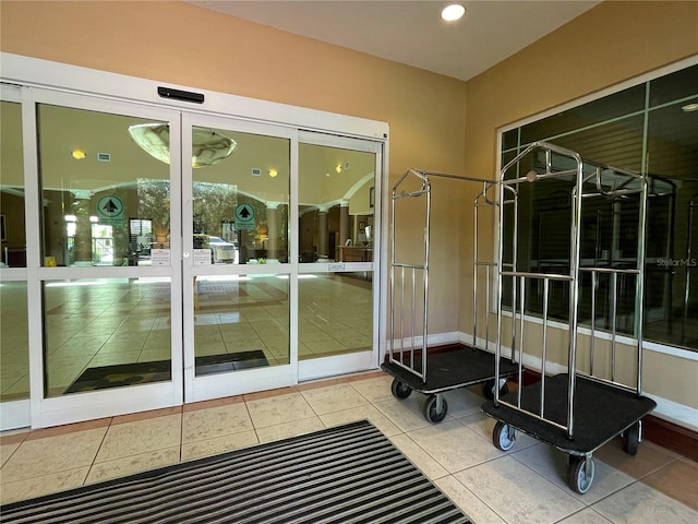 doorway with light tile flooring