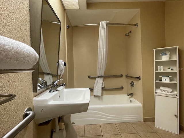 bathroom with tile floors and tub / shower combination