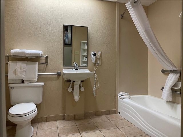 bathroom with tile flooring and toilet