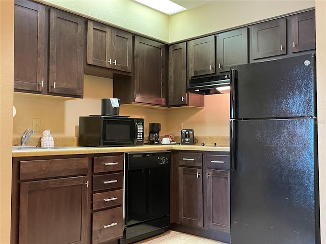 kitchen featuring fume extractor, dark brown cabinetry, sink, and black appliances