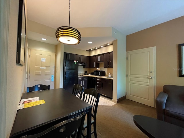 carpeted dining room featuring sink