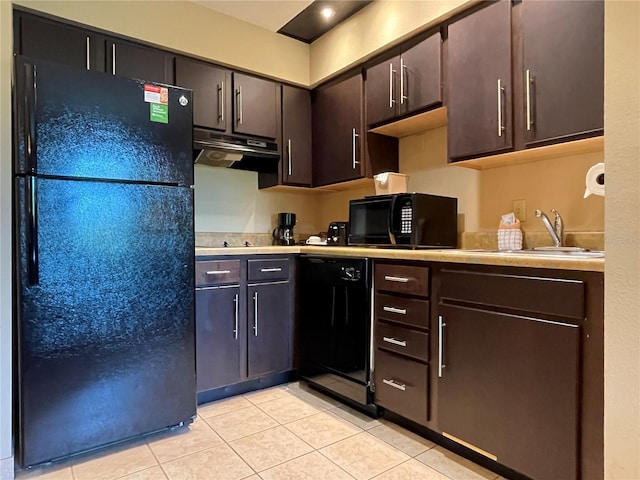 kitchen featuring black appliances, dark brown cabinets, light tile patterned floors, and sink