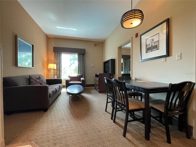 view of carpeted dining area