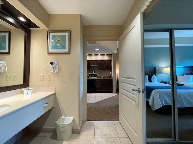 bathroom with vanity and tile floors