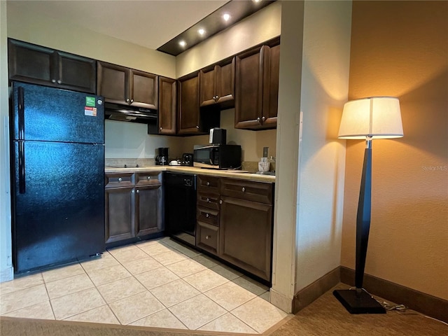 kitchen featuring dark brown cabinets, light tile floors, and black appliances