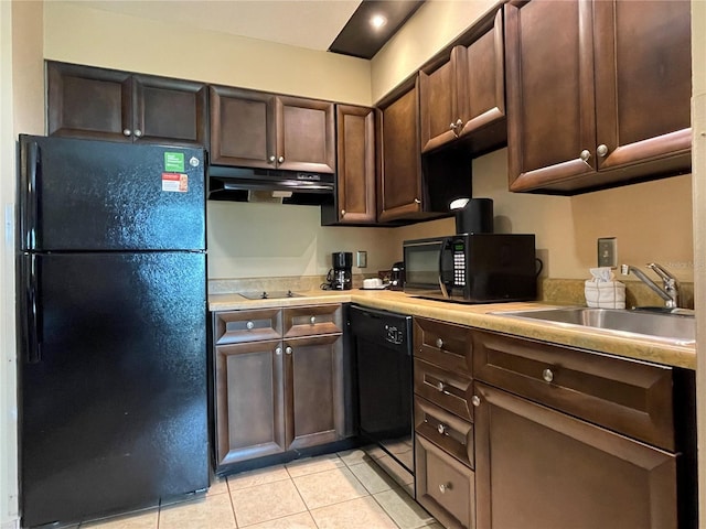 kitchen with black appliances, dark brown cabinets, sink, light tile floors, and fume extractor