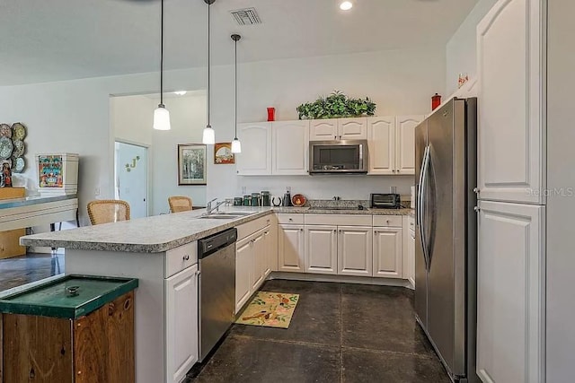 kitchen featuring stainless steel appliances, kitchen peninsula, white cabinets, hanging light fixtures, and sink