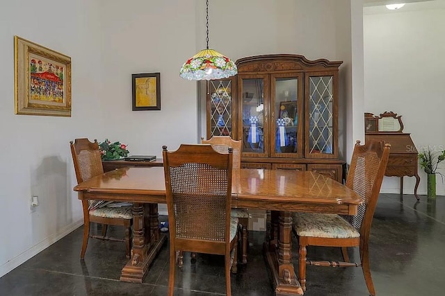 dining room with a high ceiling