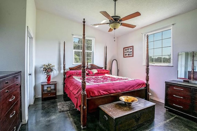 bedroom featuring a textured ceiling and ceiling fan