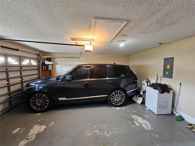 garage with electric panel and a garage door opener