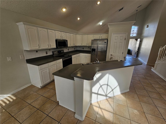 kitchen with stainless steel fridge, light tile patterned floors, black range with electric stovetop, and white cabinetry