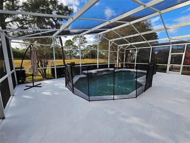 view of swimming pool featuring a patio and a lanai