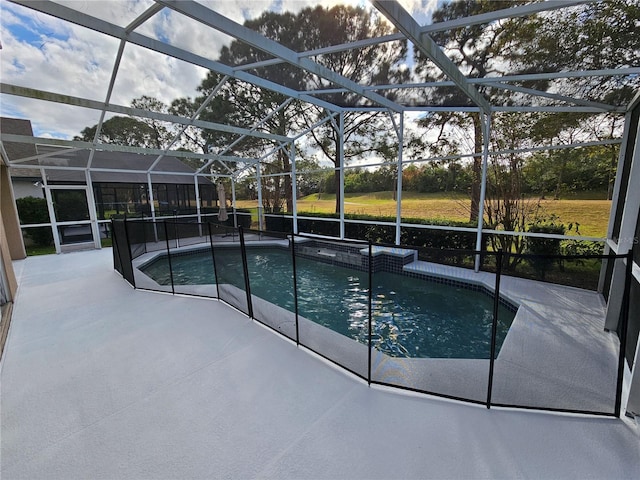 view of swimming pool featuring a lanai and a patio