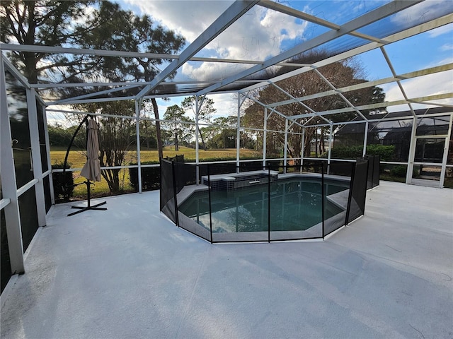 view of swimming pool featuring a lanai and a patio area