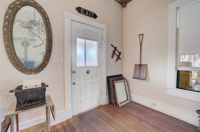 entryway with dark hardwood / wood-style floors